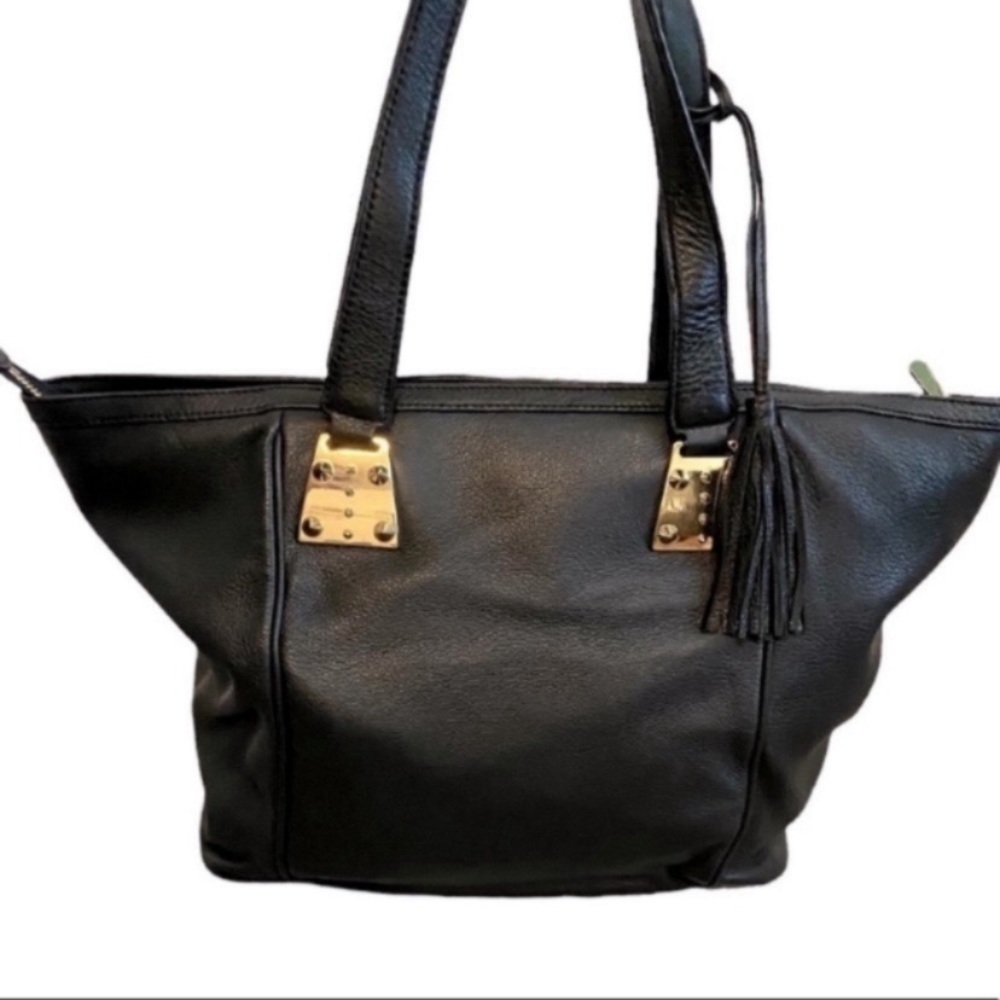 Vince Camuto black leather purse. Gold spike accents